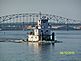 Tug boat going down the Mississippi River on a hot afternoon.. Taken August 2010 Dubuque, Iowa by Diane Harris.