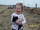 Grand daughter Isabella with spring piglet. Taken Easter 2010 Cascade, Iowa farm by Gina Gadient.