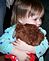 Ava Maples hugs the BINGO bear. Taken 1-30-10 our house by Patti Menster.