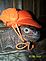 Xena pet iguana is ready to go hunting with her orange cap on !!. Taken January 2009 Dubuque, IA by Diane Harris.