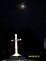 Solar powered cross in cemetery with moon. Taken April 3,2012 St Donatus cemetery by Diane Harris.