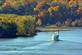 The riverboat Twilight comes around the bend . Taken in mid October  Near Sabula, Iowa by Lorlee Servin.