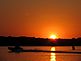 A boat follows the channel markers home at sunset. Taken Wednesday night near Casseville. by D.