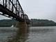 Barge passing through the train bridge By Peggy Driscoll