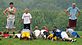 Hempstead Football Youth Camp push-ups observed by Justin Schmidt blue tee shirt. Taken Aug. 2nd 2010 Hempstead High School by Mike Waddick.