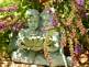 girl and boy statue with plant surrounding them. Taken 6-20-09 Backyard by Peggy Driscoll.