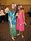 Two Hula girls employed at the Grand River Center enjoy the festivities during the Business P.M.