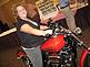 Margaret Hinkels with Stonehill Care Center sits on a Harley at the Business P.M. at the Grand River Center.