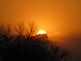 sun rising on top of storm clouds. Taken 04/10/2011 Dyersville in front of Beckman School by Debbie Antolik.