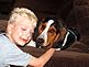 my son Jack and his dog Augie. Taken August 17, 2010 at our home by luke stumpf.