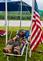 Firefighter's 9/11 dedication alongside lowered flag recently at Dragon Boat Races. Taken September 11, 2022 Camp 17, Dubuque  by Deanna Tomkins.