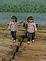 Two little girls play on the log raft. Taken recently at the Mississippi River Museum and Aquarium by Dawn Pregler.