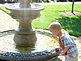 Ayden Cady putting pennies in the fountain. Taken August 